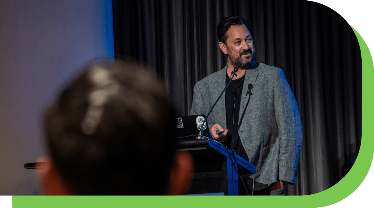 Photo of Sean McCreanor speaking on stage