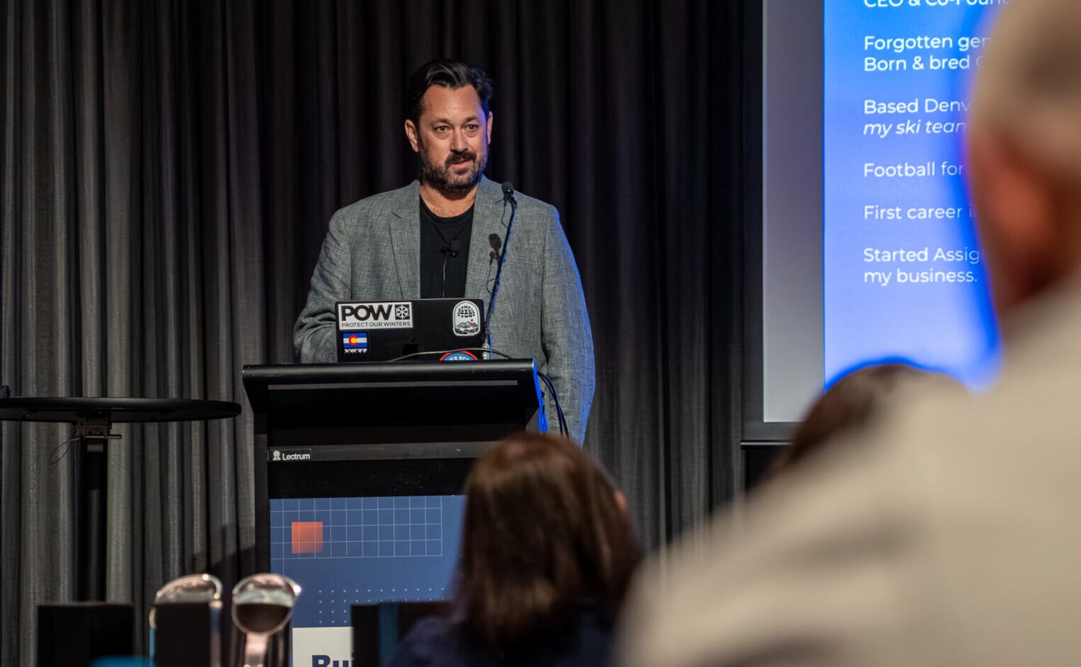 Assignar CEO Sean McCreanor speaking on agentic AI for construction at the Build Better customer event.