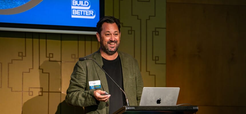 Assignar CEO Sean McCreanor presenting on AI for construction finance at the Build Better Melbourne event.